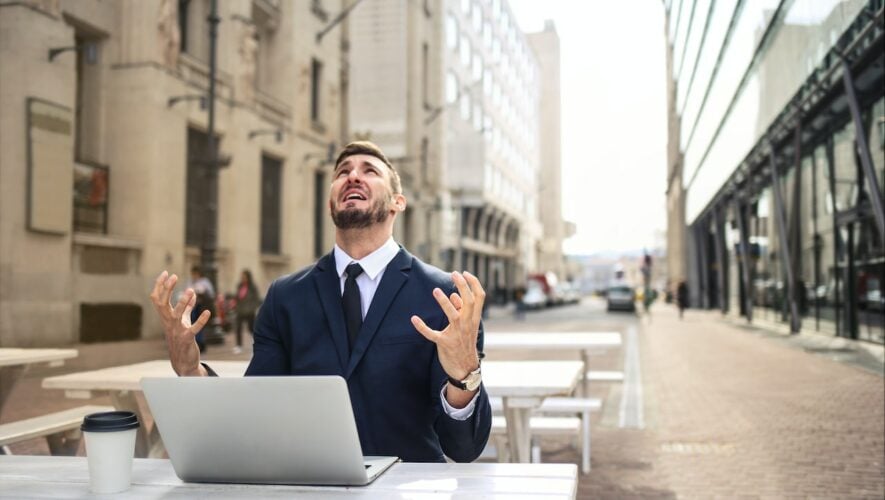 some guy in a suit yelling at the sky for no reason