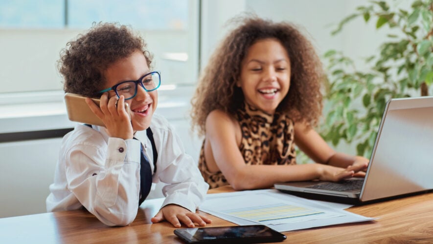 kids pretending to work in an office